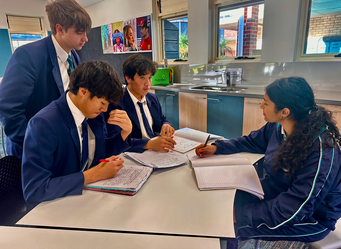 Senior students tutoring younger students.